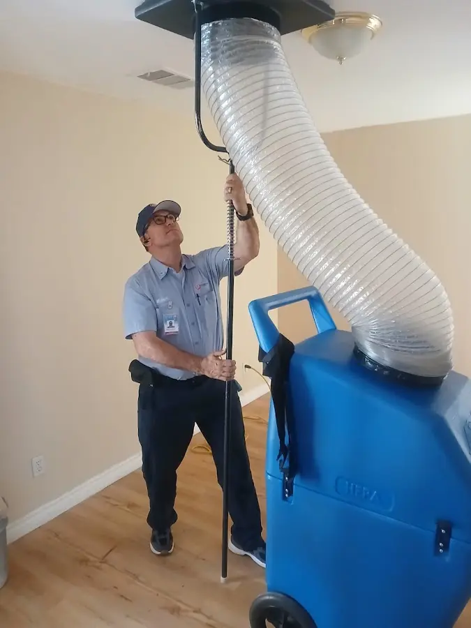 Mini Split Installation technician using HEPA equipment in Clovis